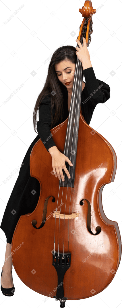 Front view of a pleased young woman embracing her double-bass