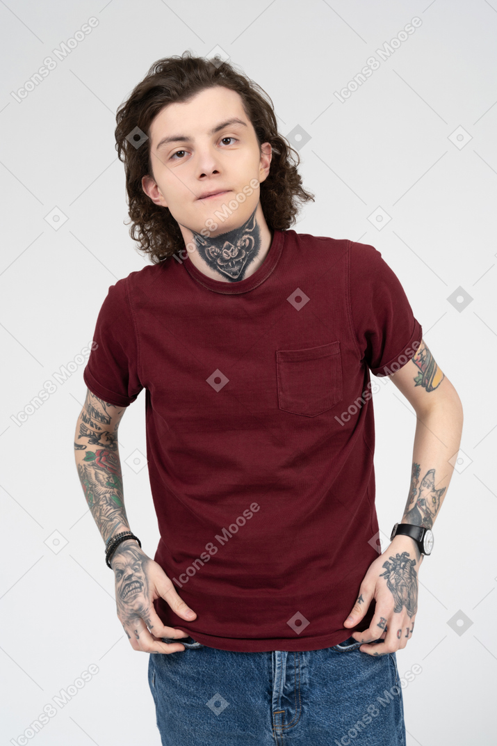 Young tattooed man facing the camera