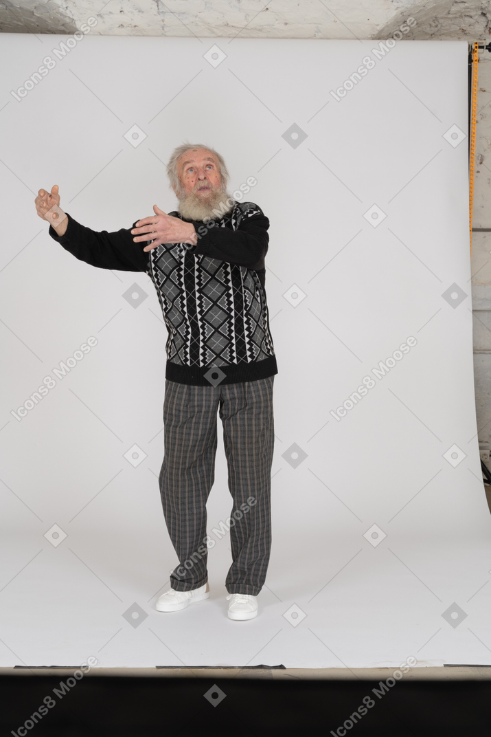 Old man looking up and gesticulating