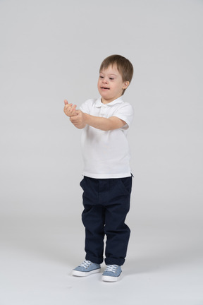 Little boy with his arms outstretched