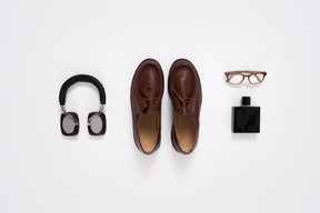 Headphones, shoes, perfume bottle and eyeglasses