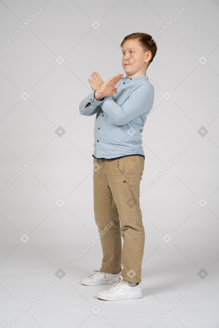 Boy making stop gesture