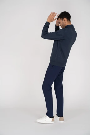 Man in black clothes posing