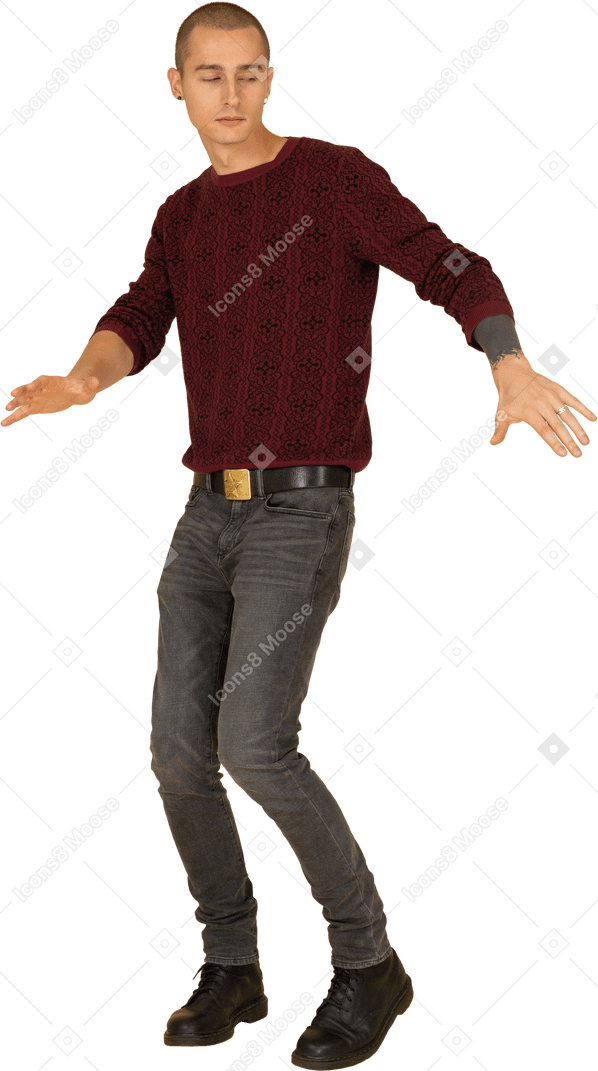 Three-quarter view of a dancing young man in red pullover