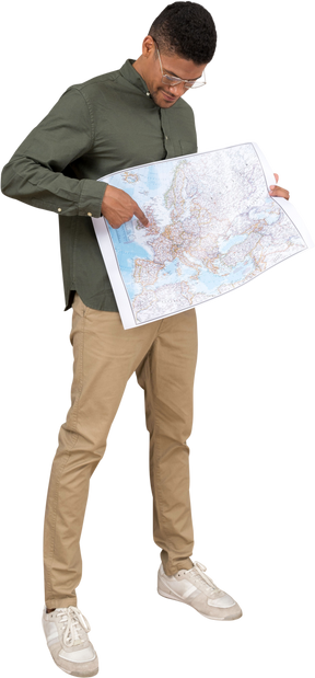 Three-quarter view of a man looking and pointing at a map