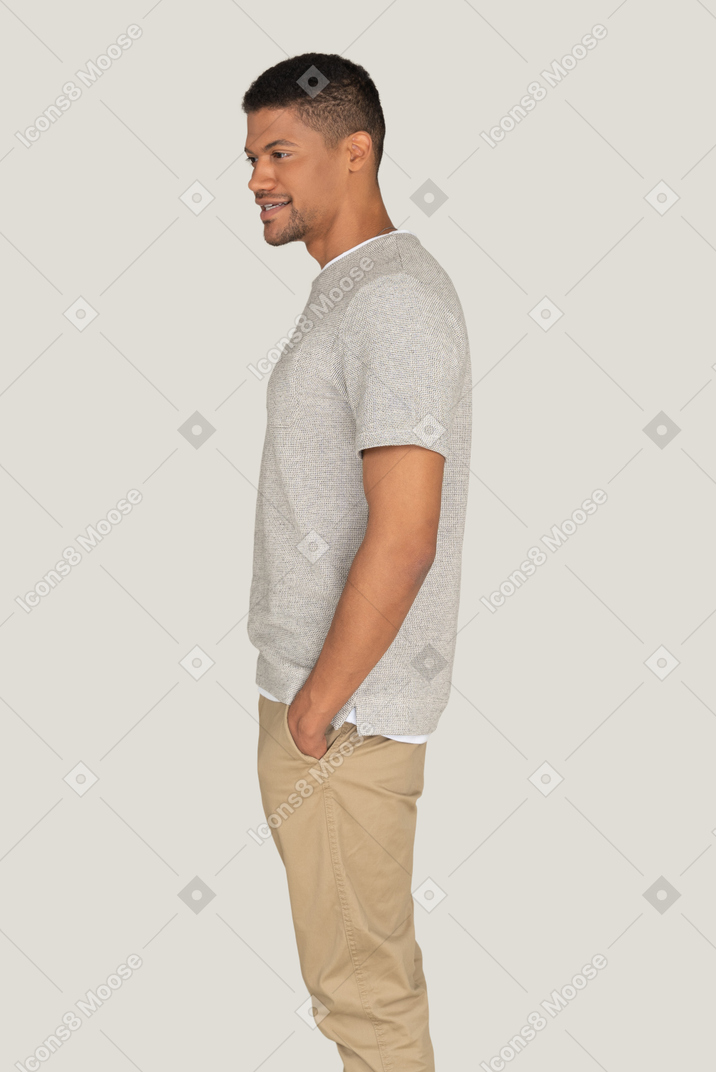 A side view of the good looking young man in casual clothes