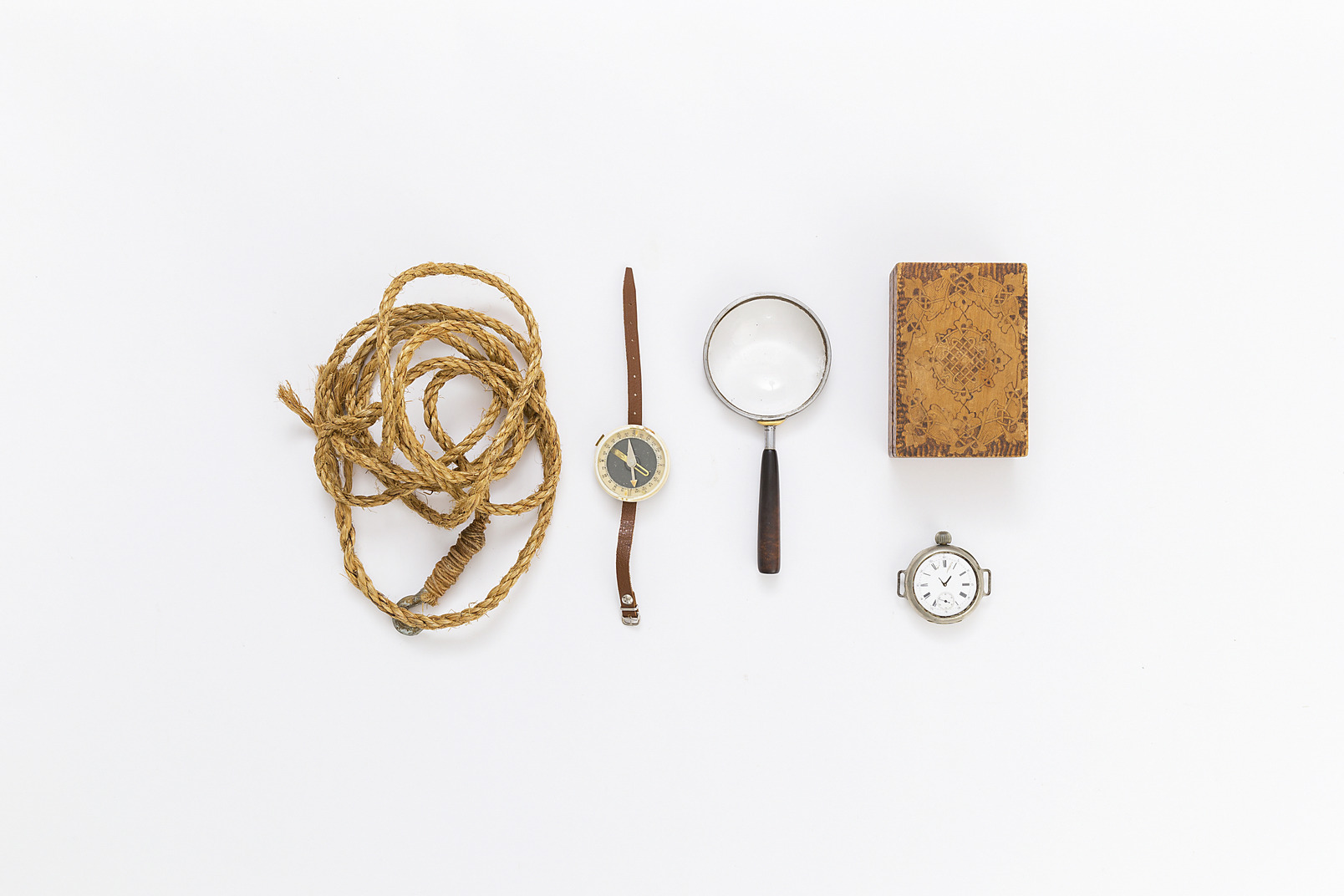 Rope with hook, pocket watch, magnifying glass, vintage box and compass