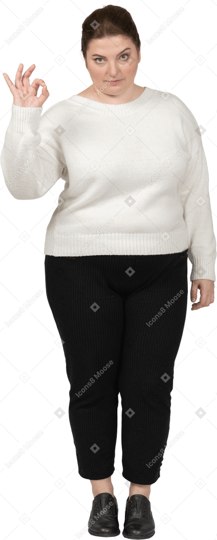 Plump woman in casual clothes showing ok sign