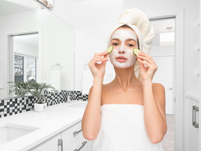 Woman applying face mask