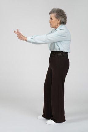 Old lady giving stop gesture