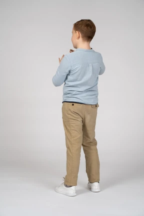 Boy standing back to camera