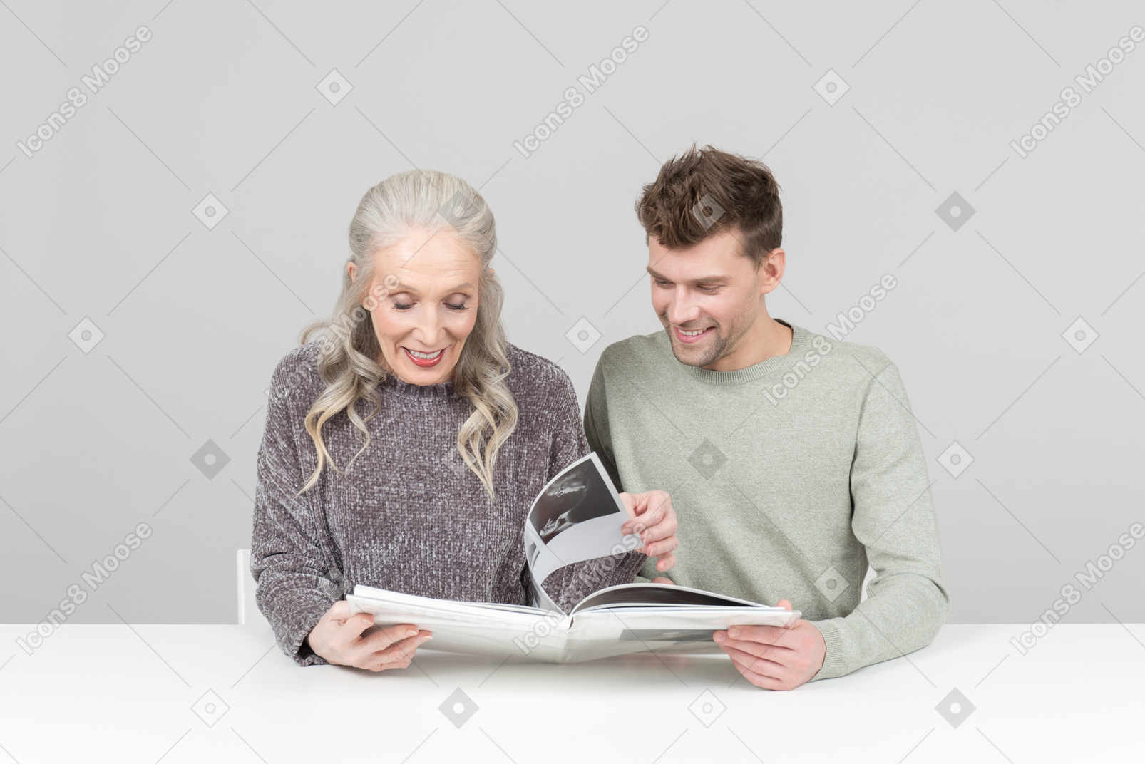 Browsing through a family photo album together