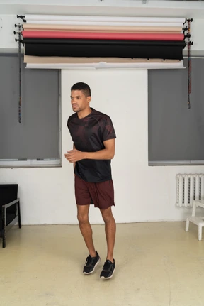 Young man in sports clothes jogging