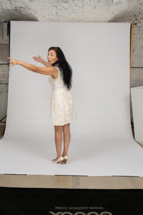 Woman in a white dress standing