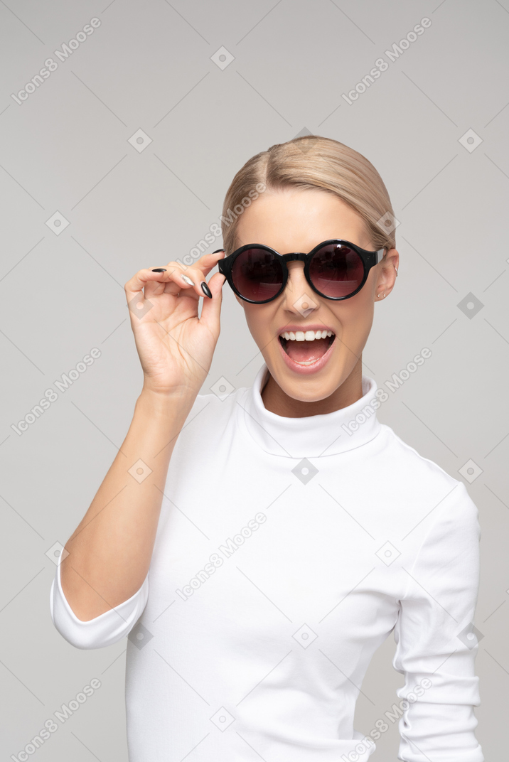 Attractive smiling woman wearing sunglasses
