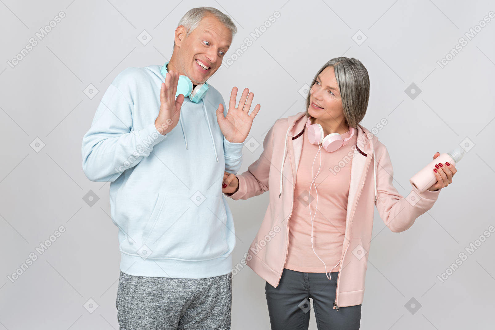 Middle aged couple in sportswear discussing some stuff