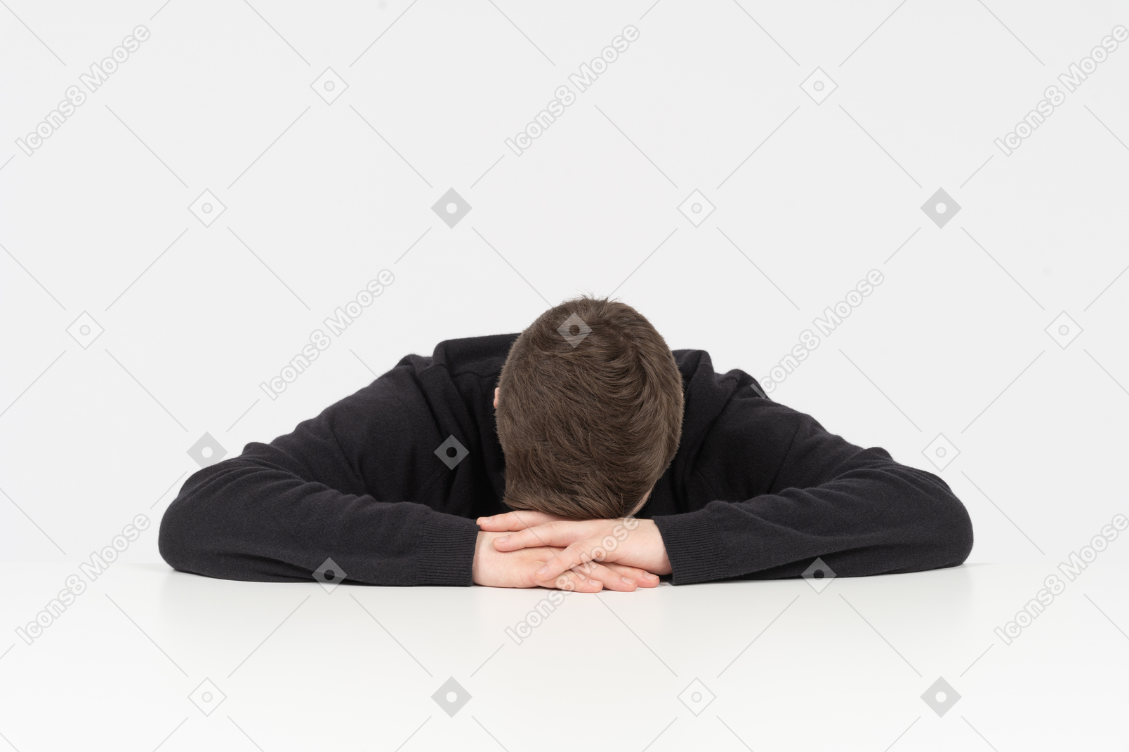 Exhausted office worker sleeping at his desk