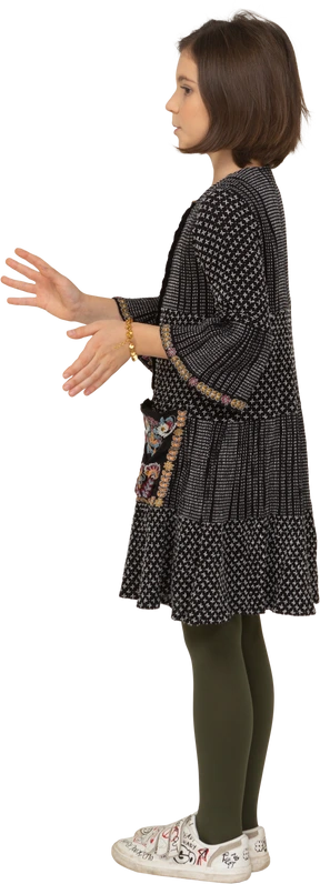 Side view of a gesticulating little girl in dress