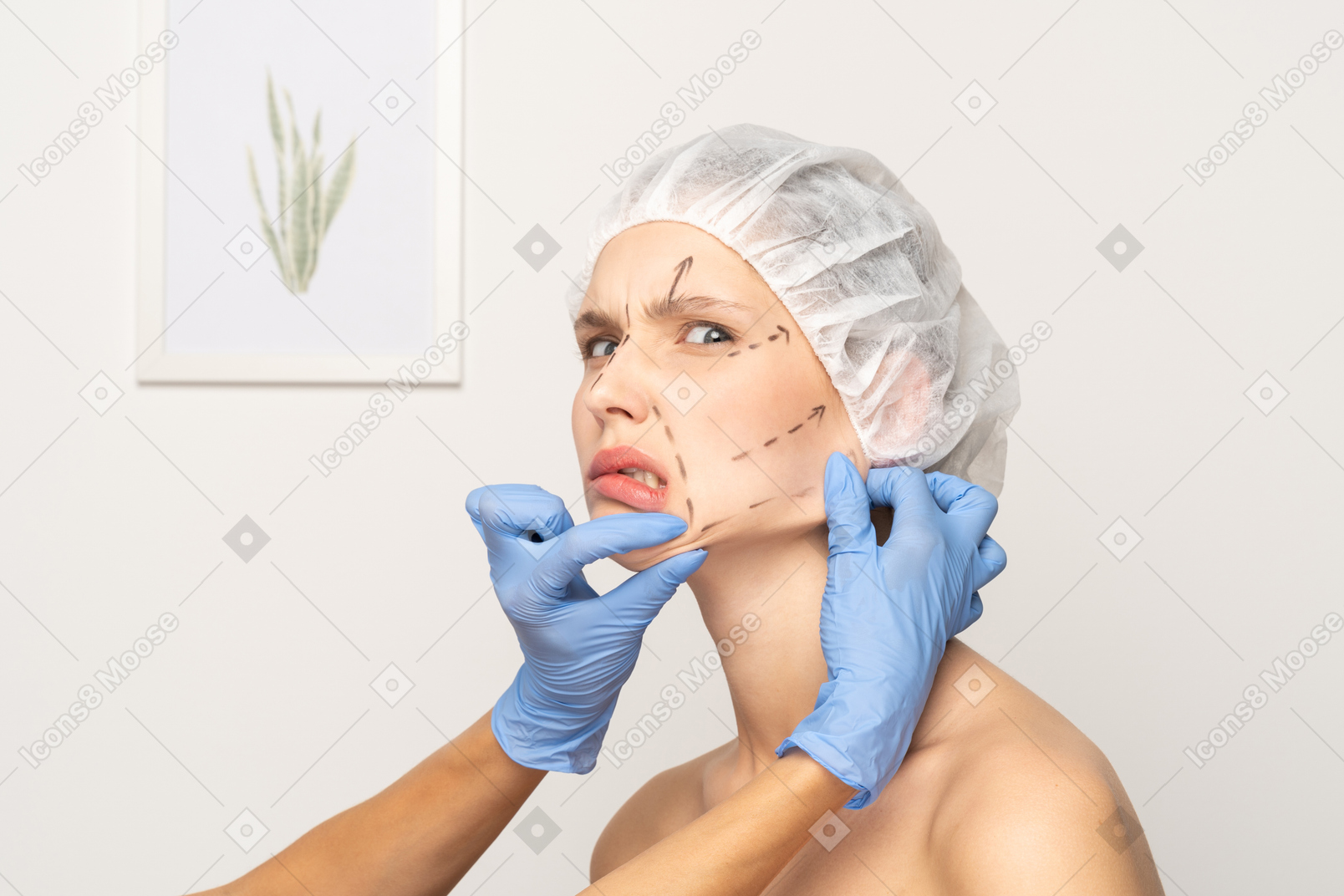 Young woman annoyed at hands pulling her skin