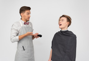 A young barber and his client