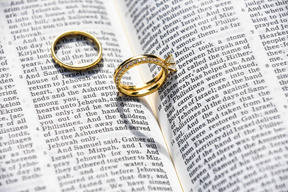 Golden ring on open book