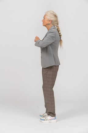 Side view of an old lady in suit