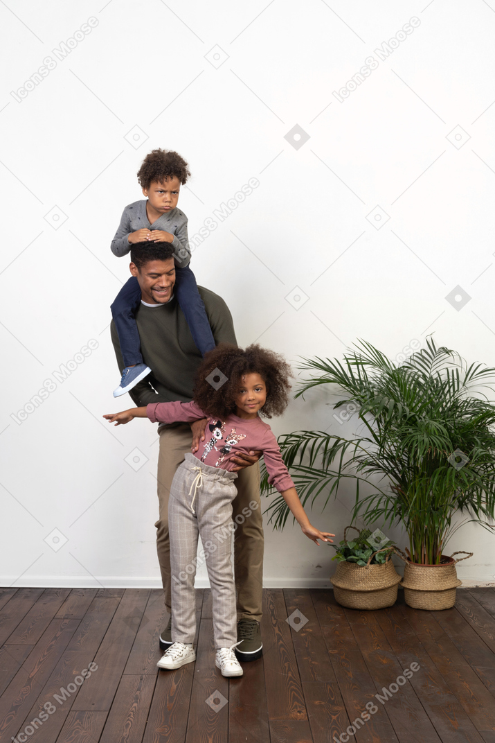 Good looking father with his happy children