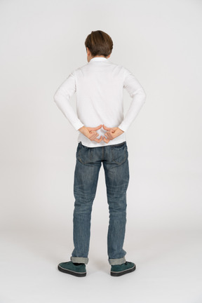 Young man in casual clothes standing