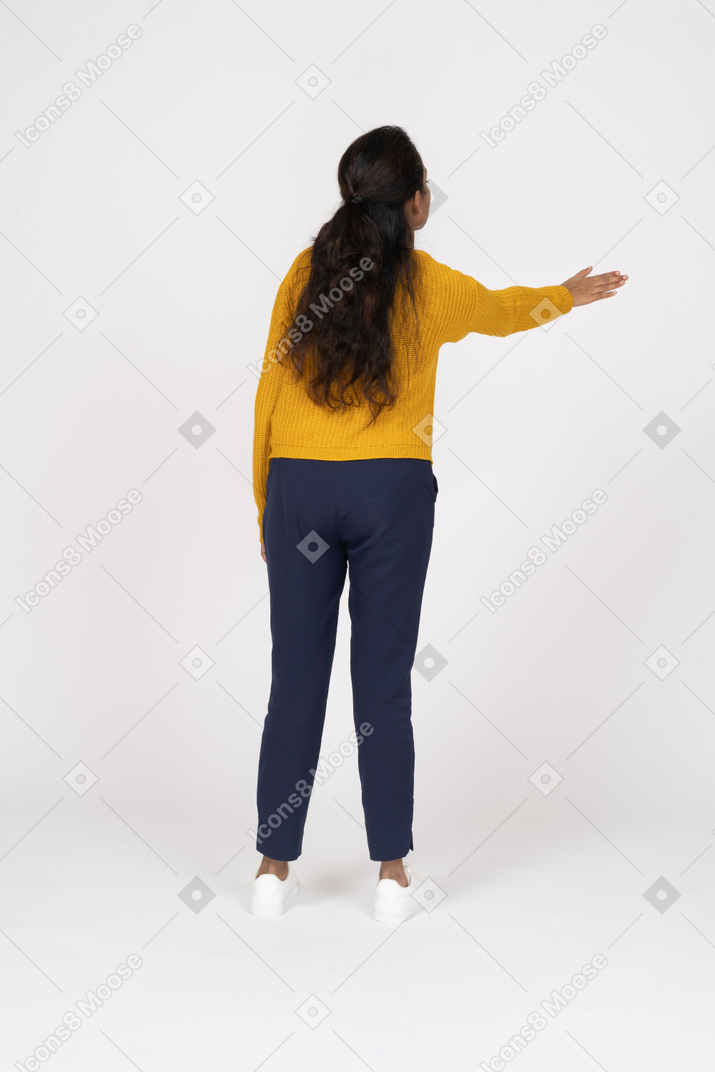 Rear view of a girl in casual clothes making welcoming gesture