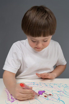 Cute little boy coloring drawing
