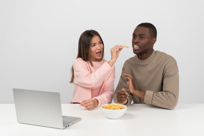 Attractive couple watching some show online together