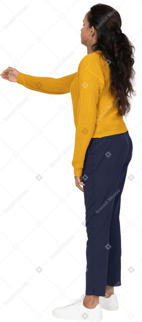 Side view of a girl in casual clothes showing direction