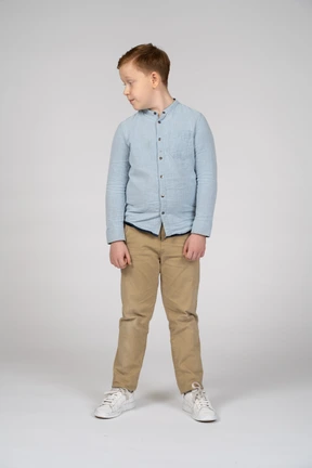 Front view of a boy in casual clothes looking aside