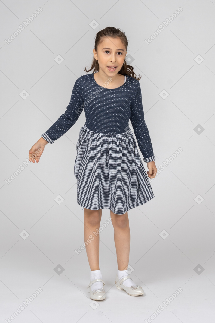 Front view of a girl leaning forward in motion