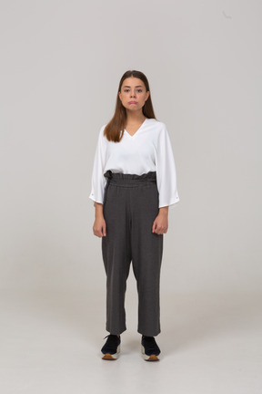 Front view of an upset young lady in office clothing