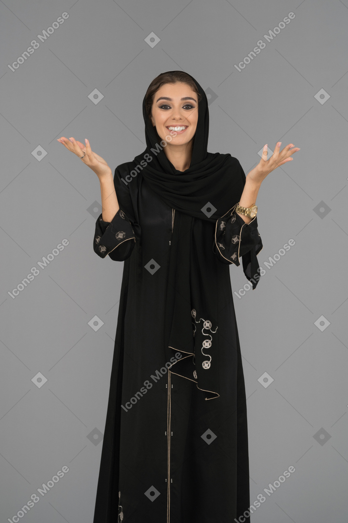 Happy muslim woman gesturing