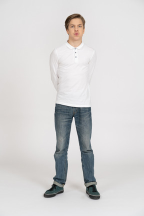 Young man in casual clothes standing