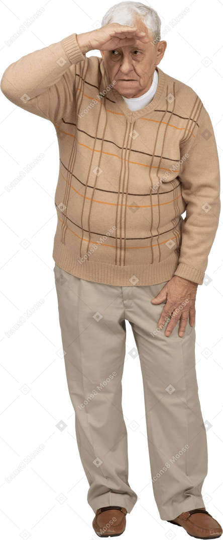 Front view of an old man in casual clothes looking for someone