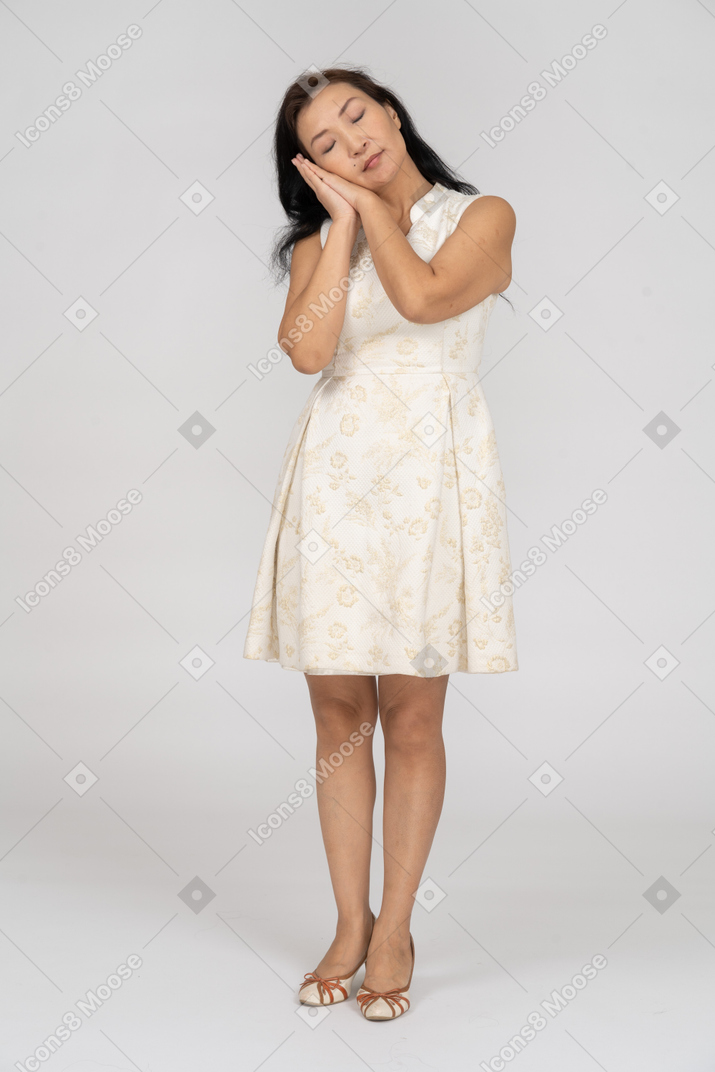 Woman in a white dress standing