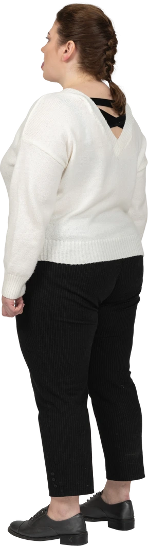 Plump woman in casual clothes standing