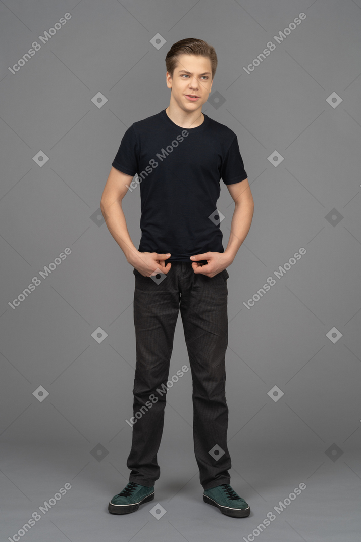 A cheerful young man looking sideways