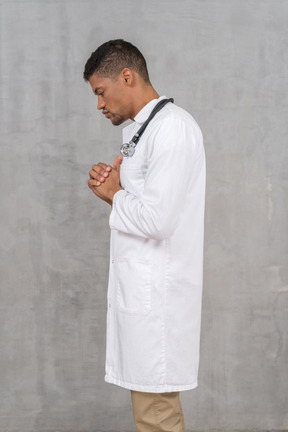 Side view of pensive doctor