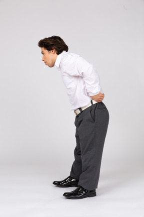 Man pulling up trousers