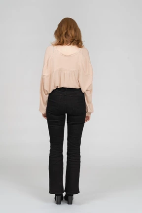 Back view of young woman standing