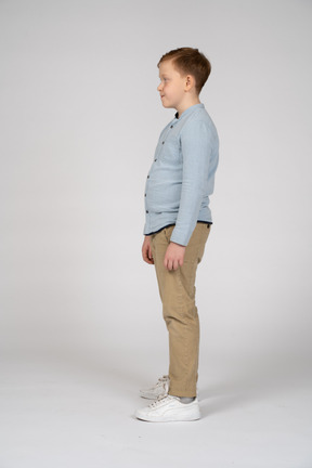 Boy standing in profile