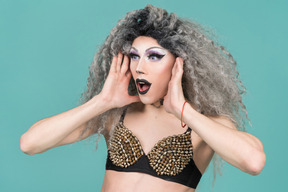 Portrait of a drag queen looking very surprised