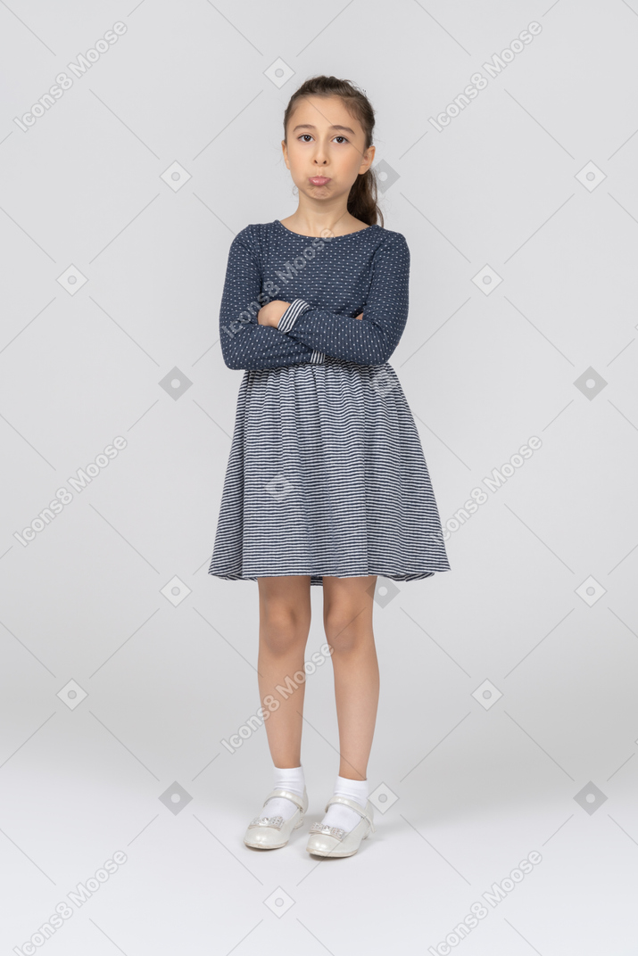 Front view of a girl folding hands and pouting cutely