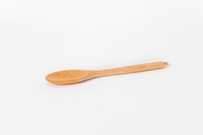 Wooden spoon on white background