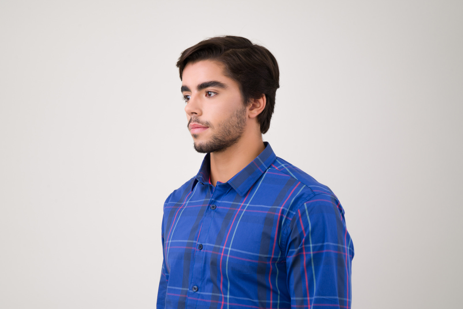 Young handsome man in a blue shirt
