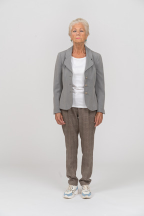 Front view of a beautiful old woman in suit